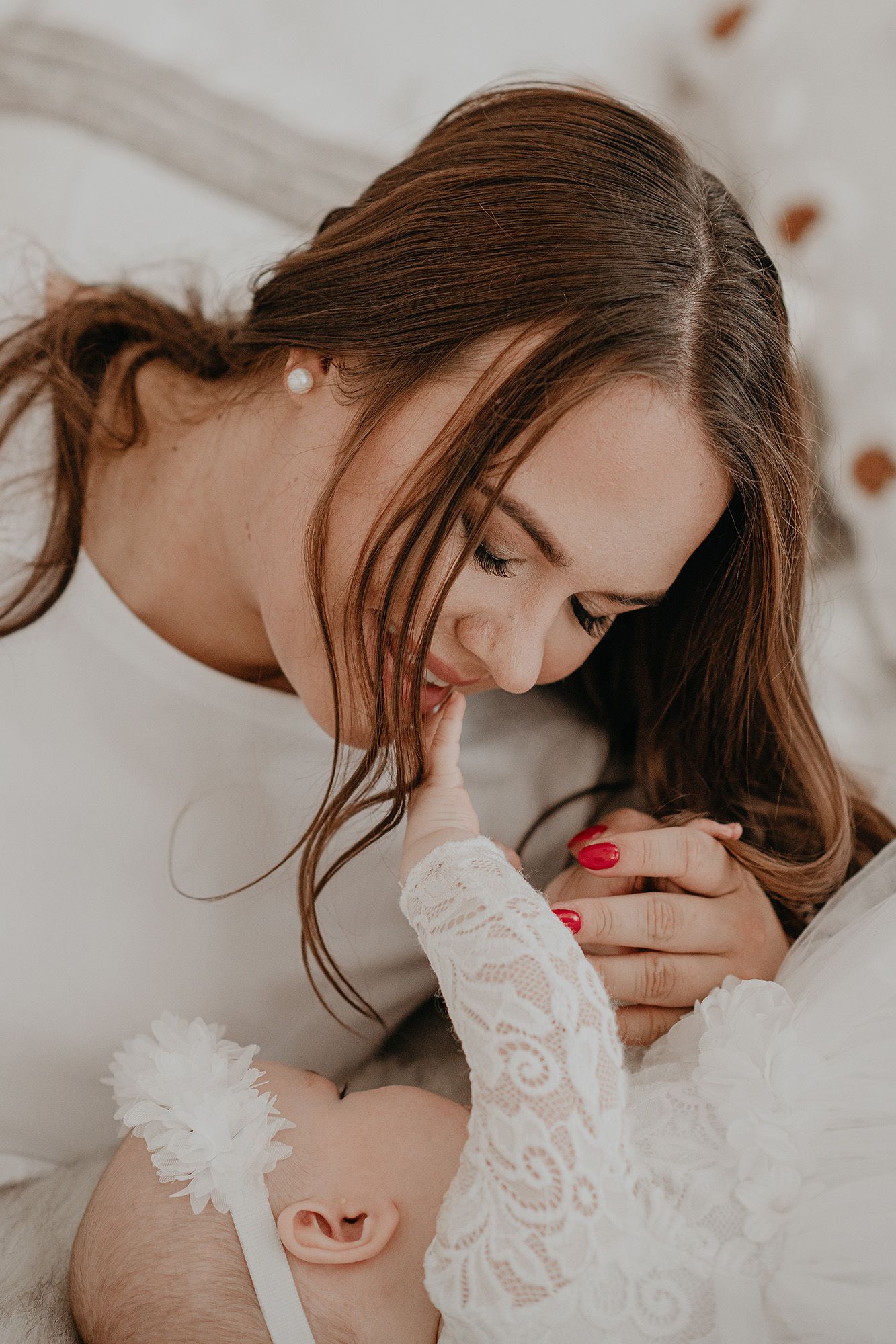 A series of intimate black and white photographs showing tender moments between a couple in soft lighting.