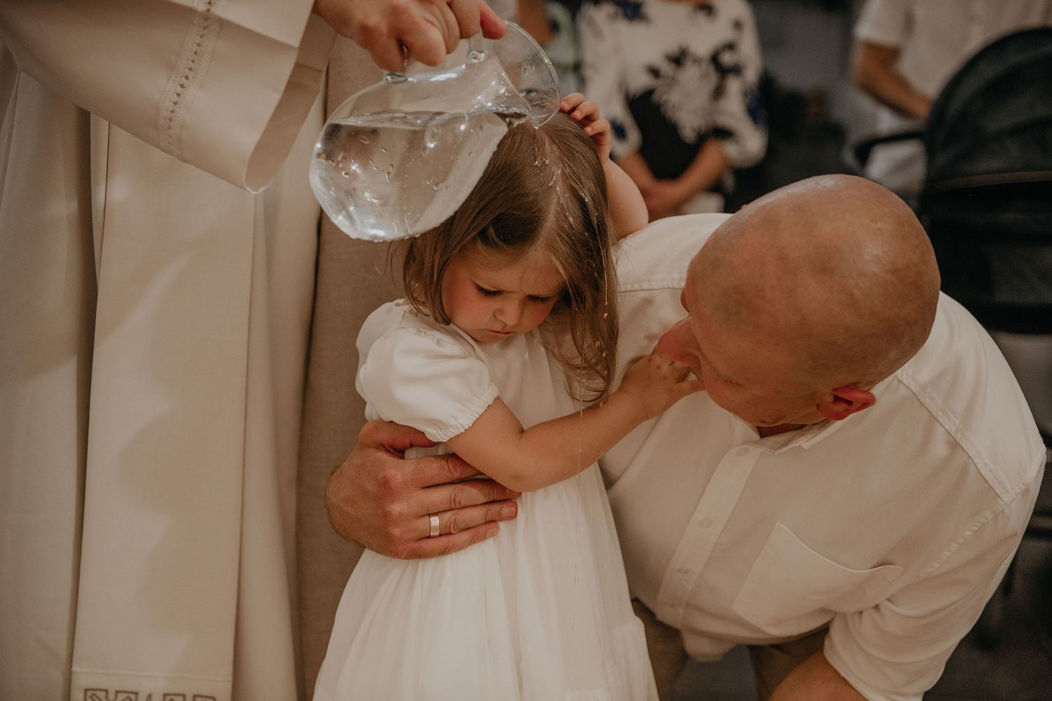 Intimate family moments captured in soft lighting during a special celebration.