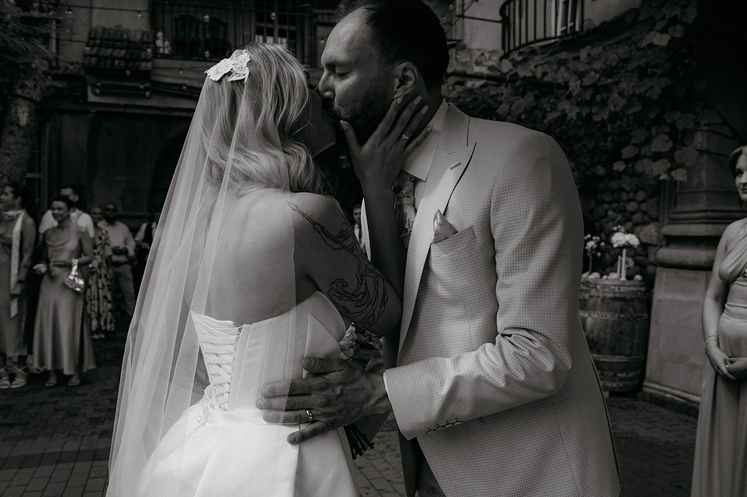 A romantic black and white wedding photo collage showing intimate moments between a couple on their special day.