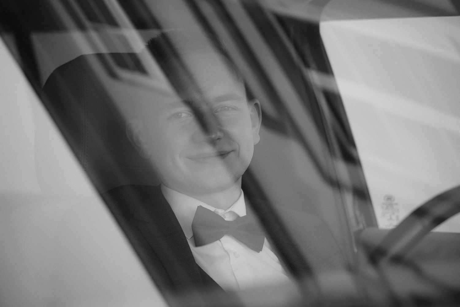 A series of black and white headshot portraits arranged in a horizontal strip layout.