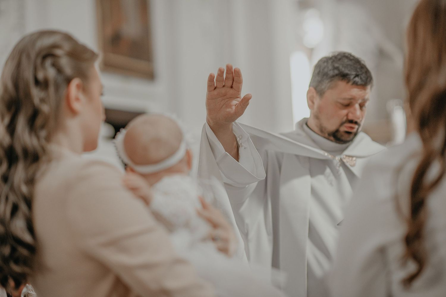 A couple in white outfits shares tender moments during their wedding photoshoot in multiple candid poses.
