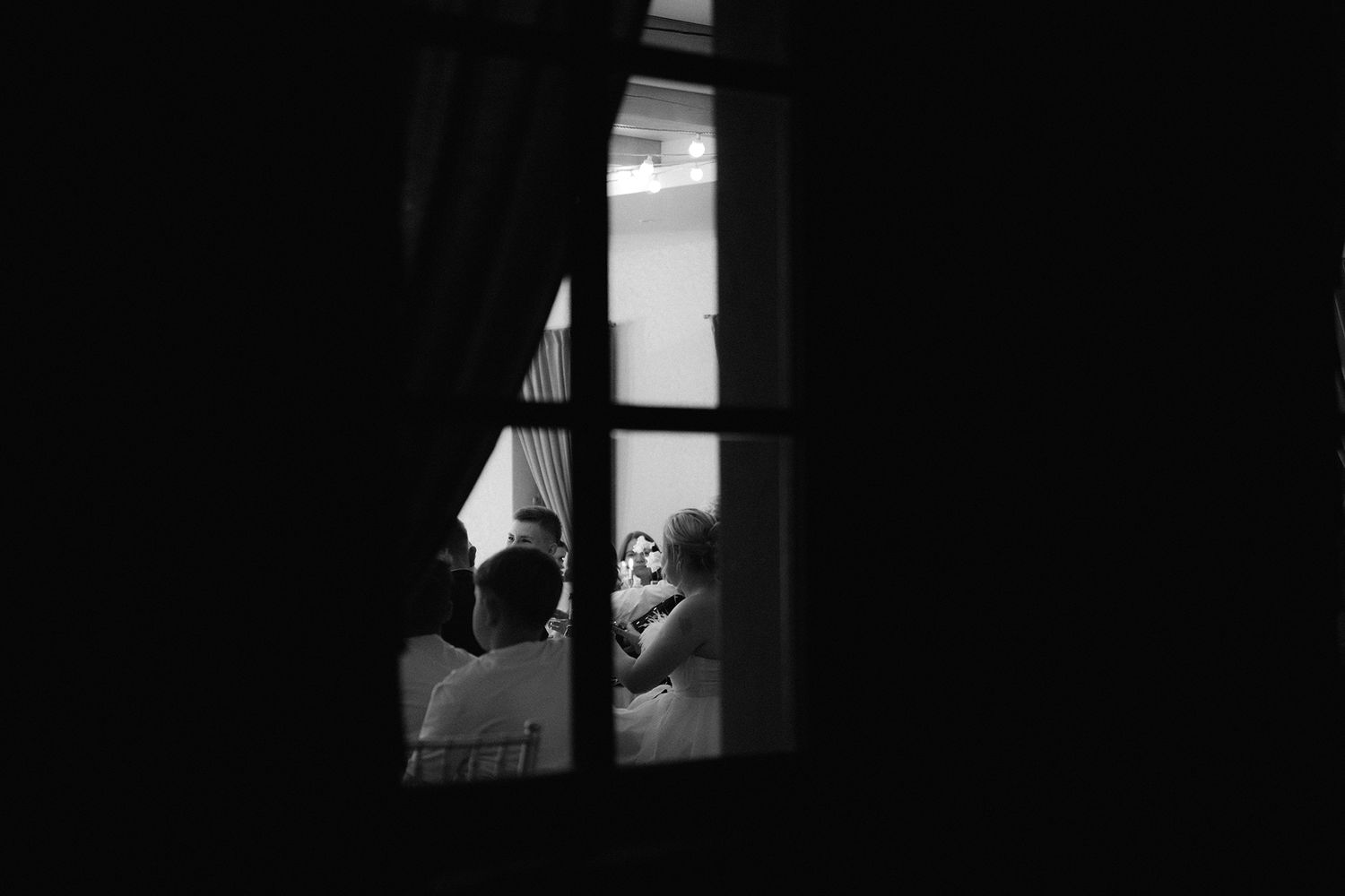 A series of six black and white film stills showing dramatic scenes with silhouettes and shadows in dark rooms.