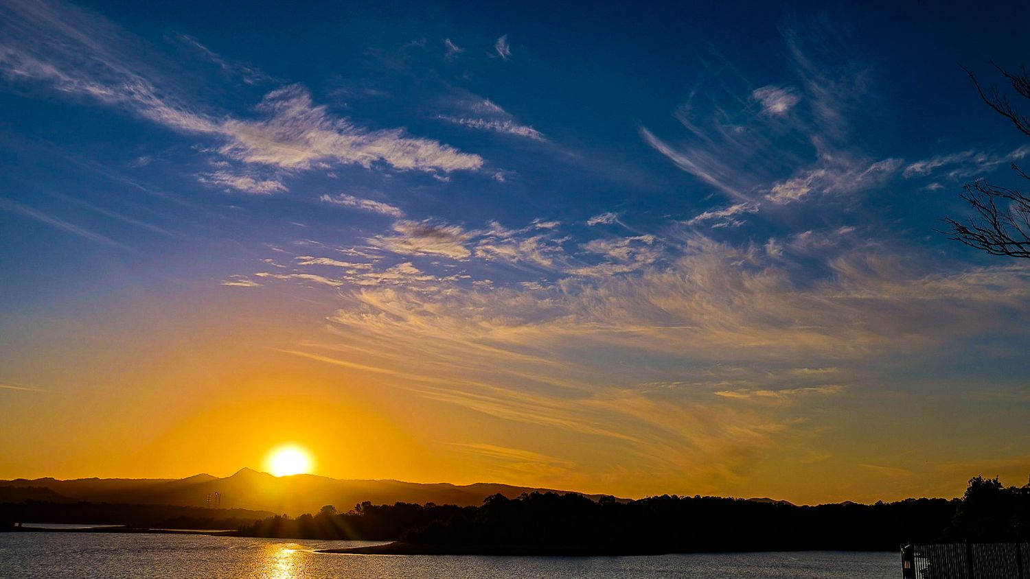 A wide angle shot of the sun and sky