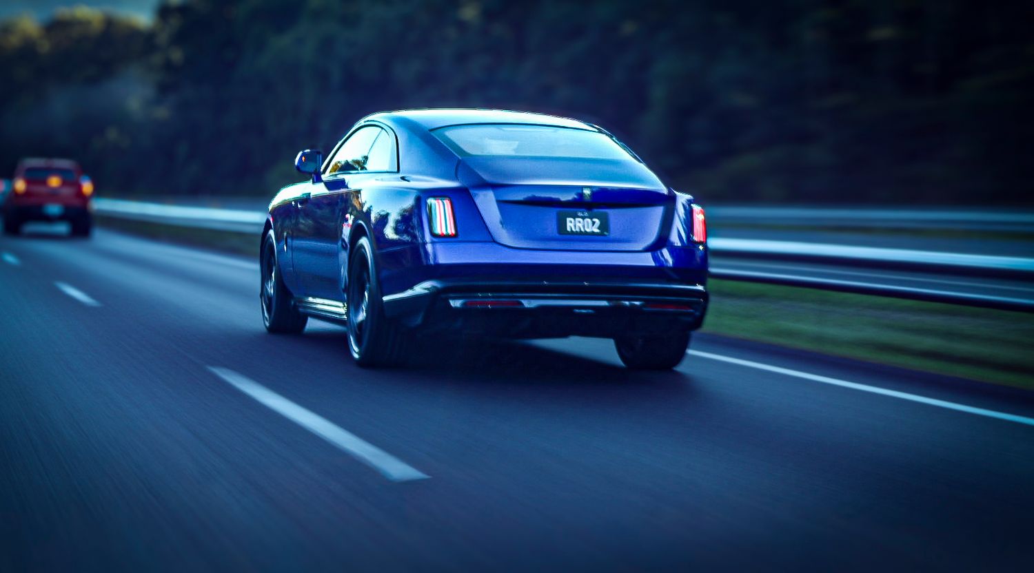 Rolling shot of a Rolls Royce Spectre heading to Noosa Concourse after I Detailed it