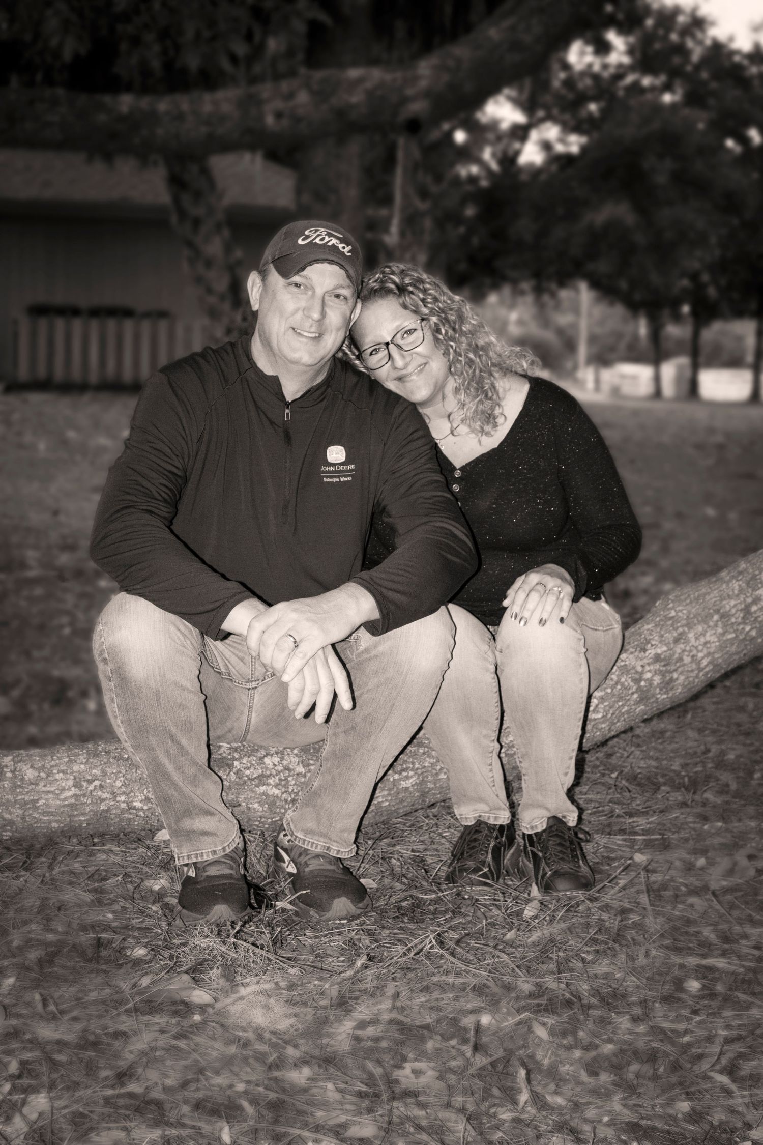 Maternity photographer Savannah GA, couple sitting grass outdoor black white session — The Quiet Lens Studio