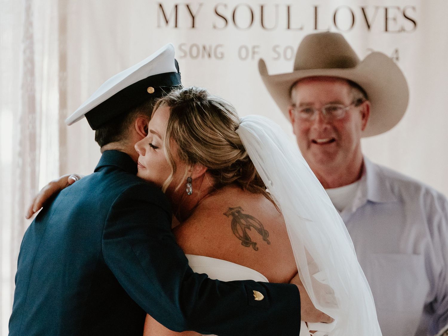 Romantic wedding ceremony moment under elegant text reading 'MY SOUL LOVES'.
