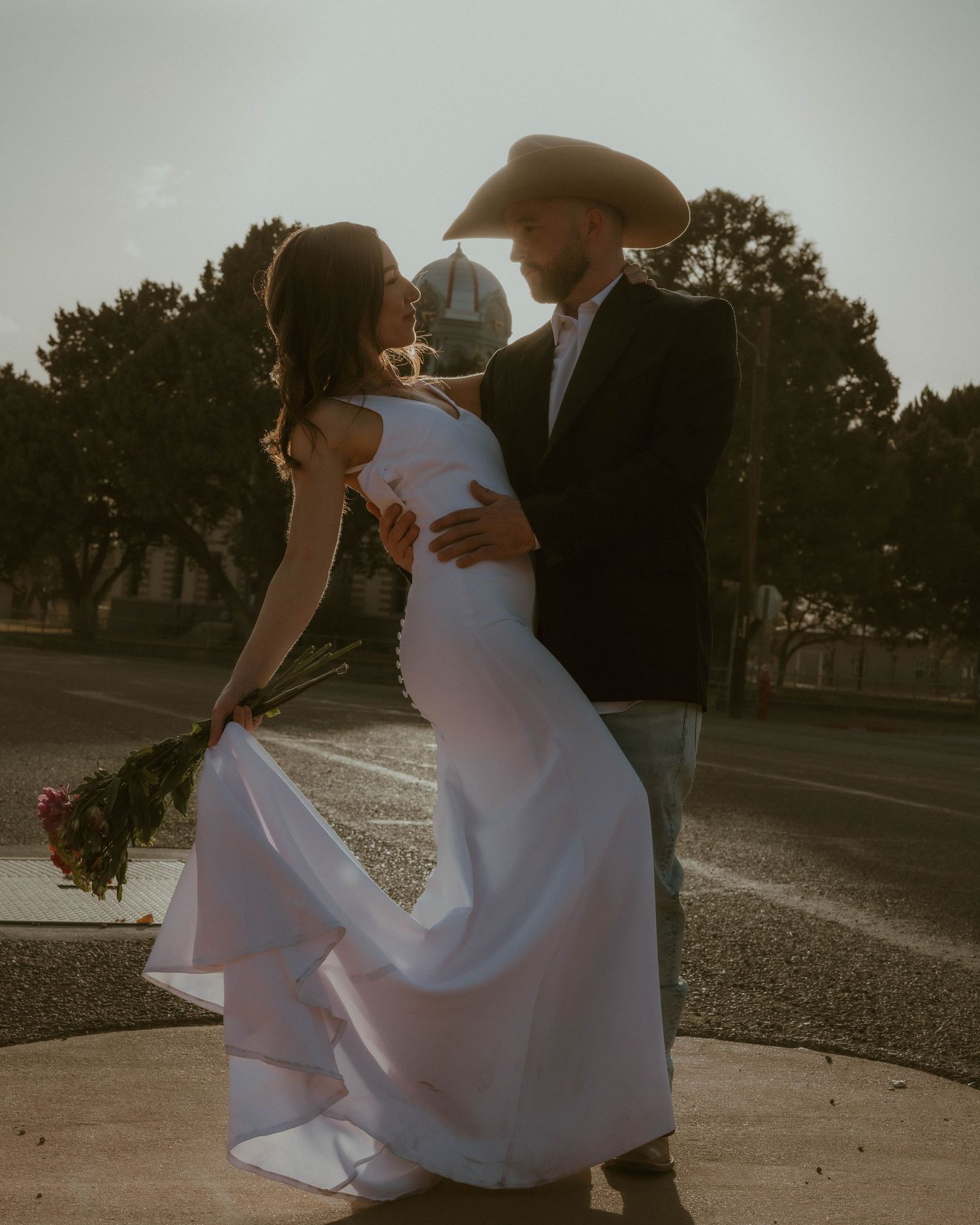 Romantic dance sequence at sunset with flowing white dress movement.