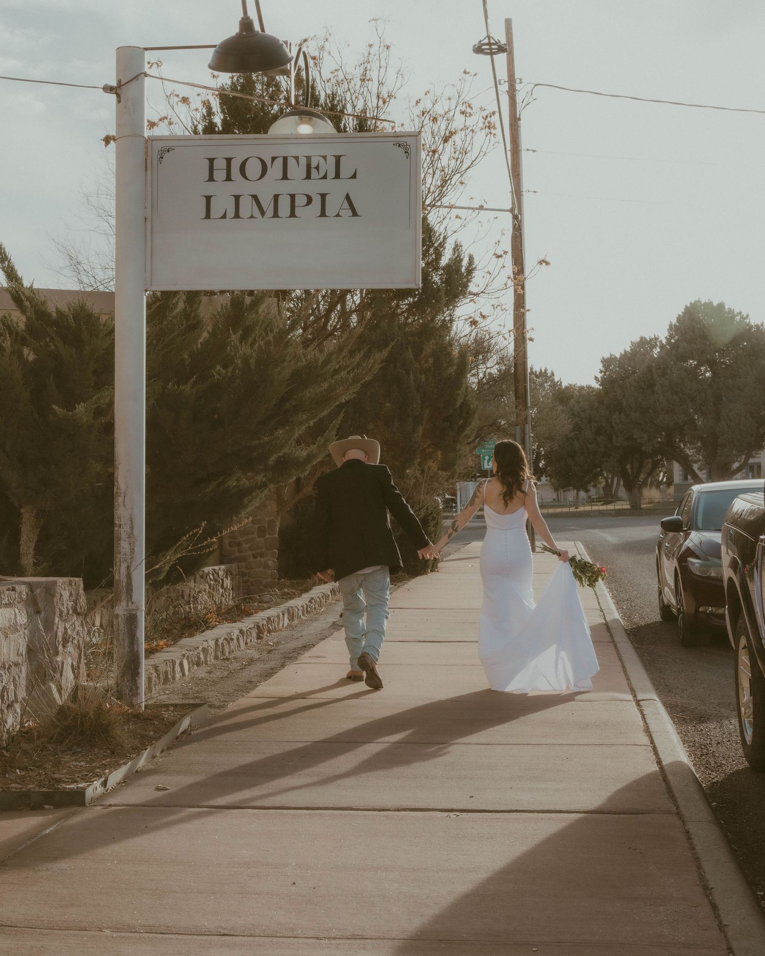 A playful sequence showing movement and dancing outside a hotel entrance.
