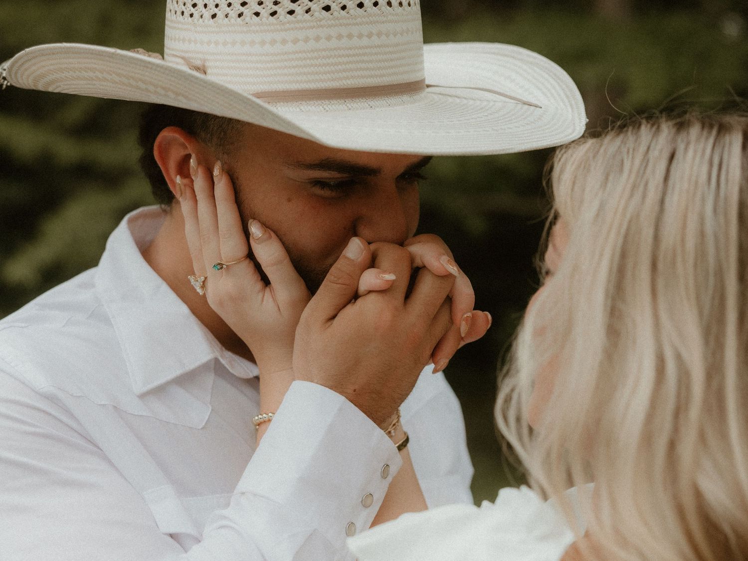 Intimate close-up moments captured during rustic outdoor couple photoshoot.