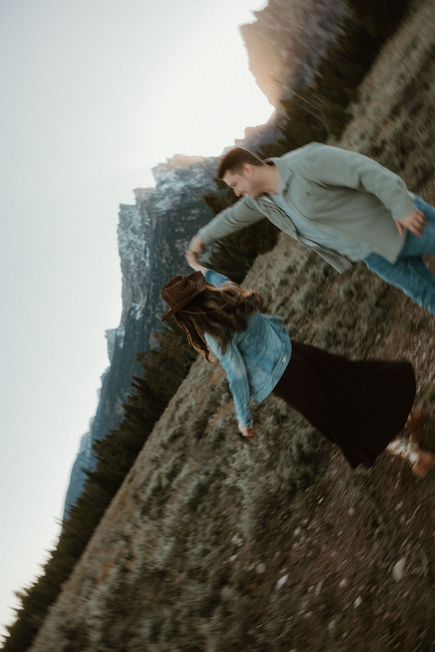 Artistic tilted photo sequence of couple dancing in mountain landscape.