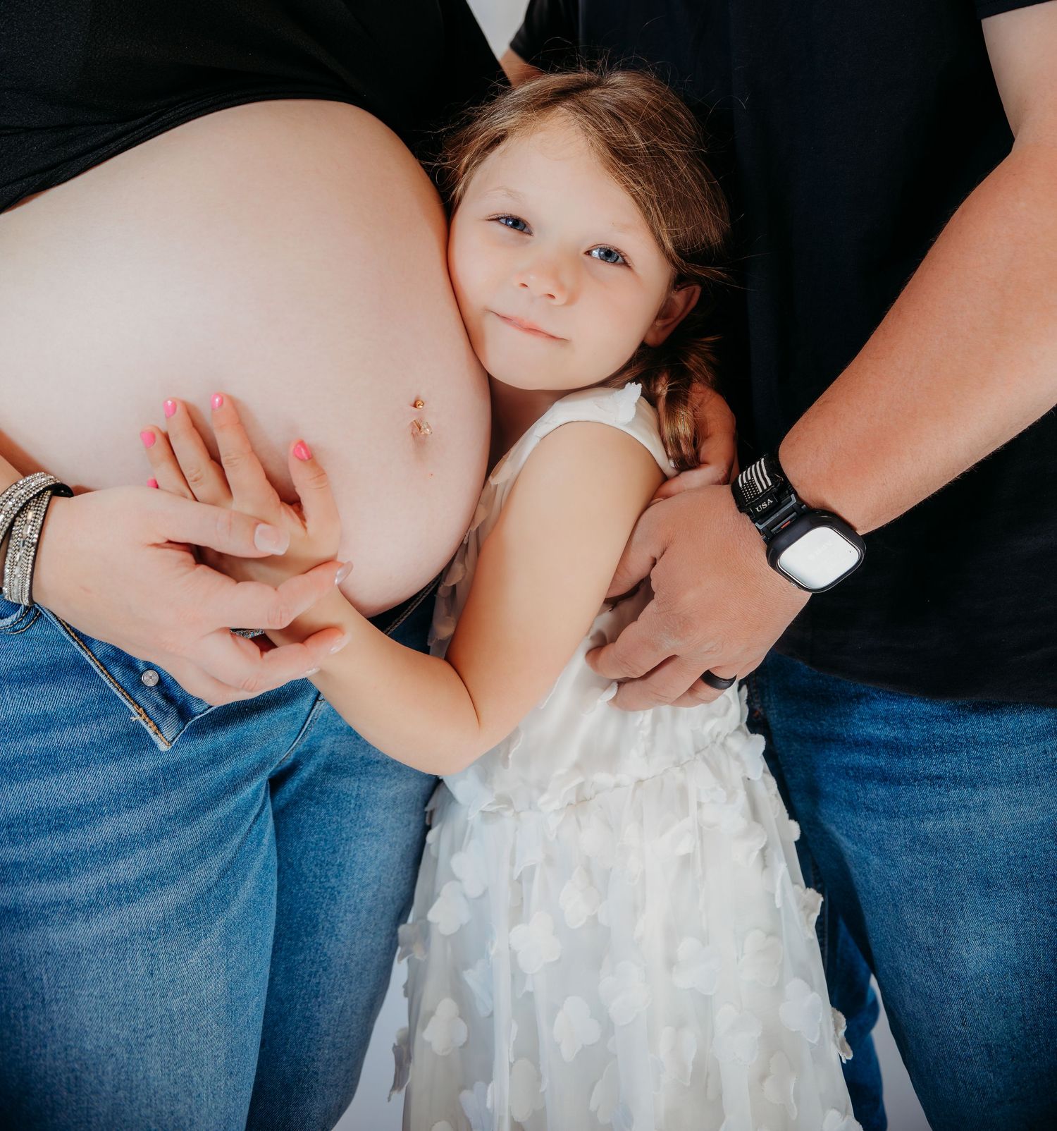 Series of photos showing a white tulle dress against blue denim in a maternity style composition.