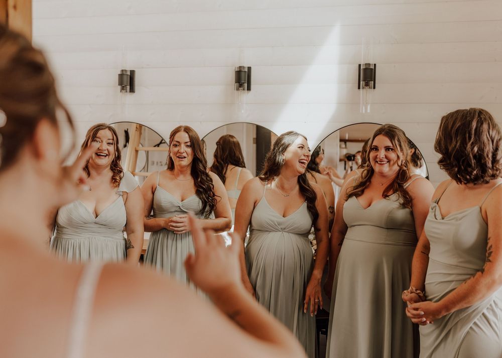 Calgary, Alberta Wedding bridesmaid first look with bride