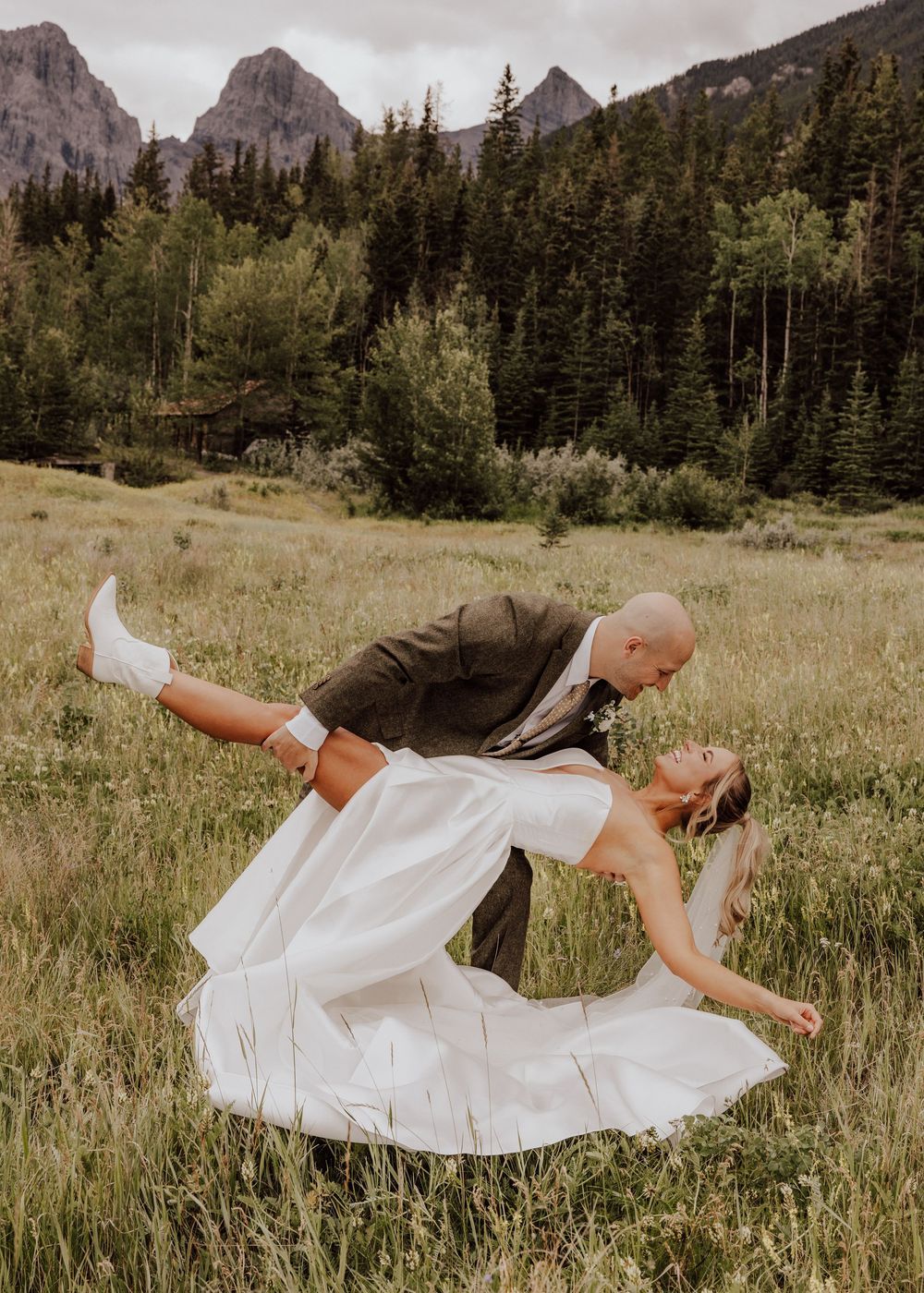 Canmore, Alberta wedding bride and groom with mountain background