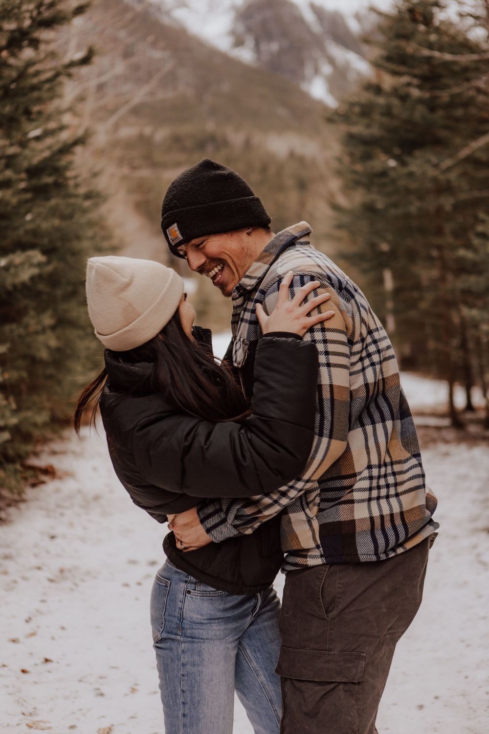 Canmore, Alberta engagement during winter with mountain background