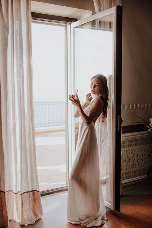 Amalfi, Italy Elopement bride getting ready in the morning in silk dress