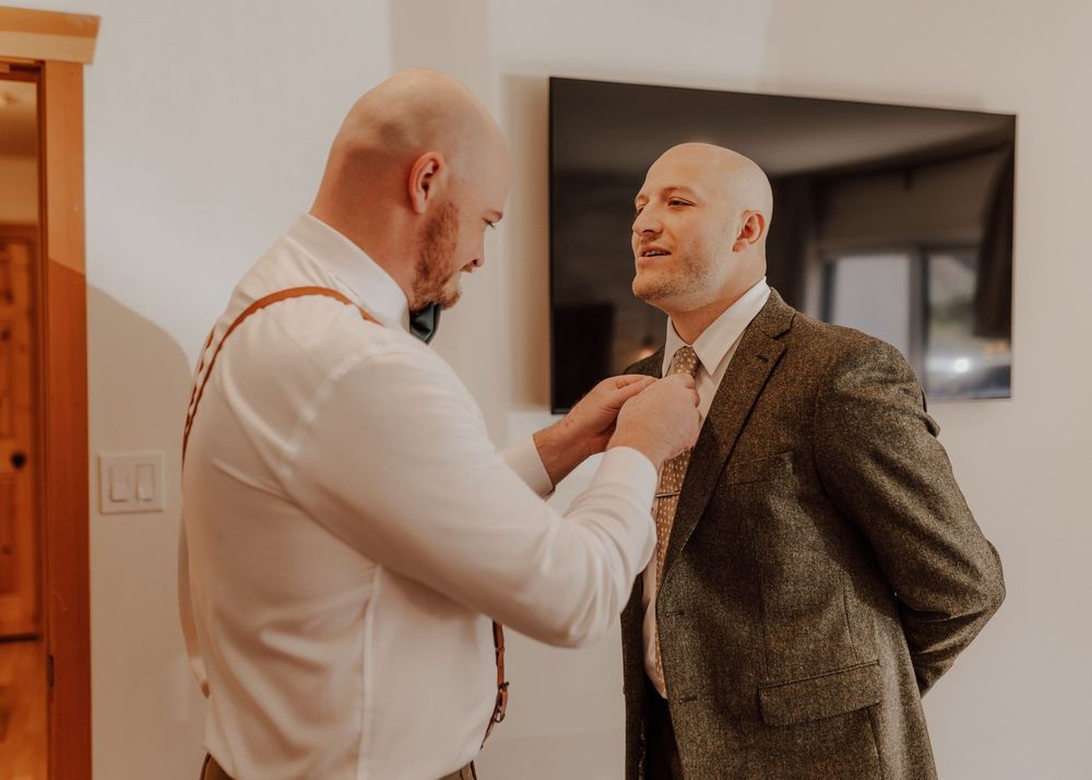 Canmore wedding photos with groom getting ready