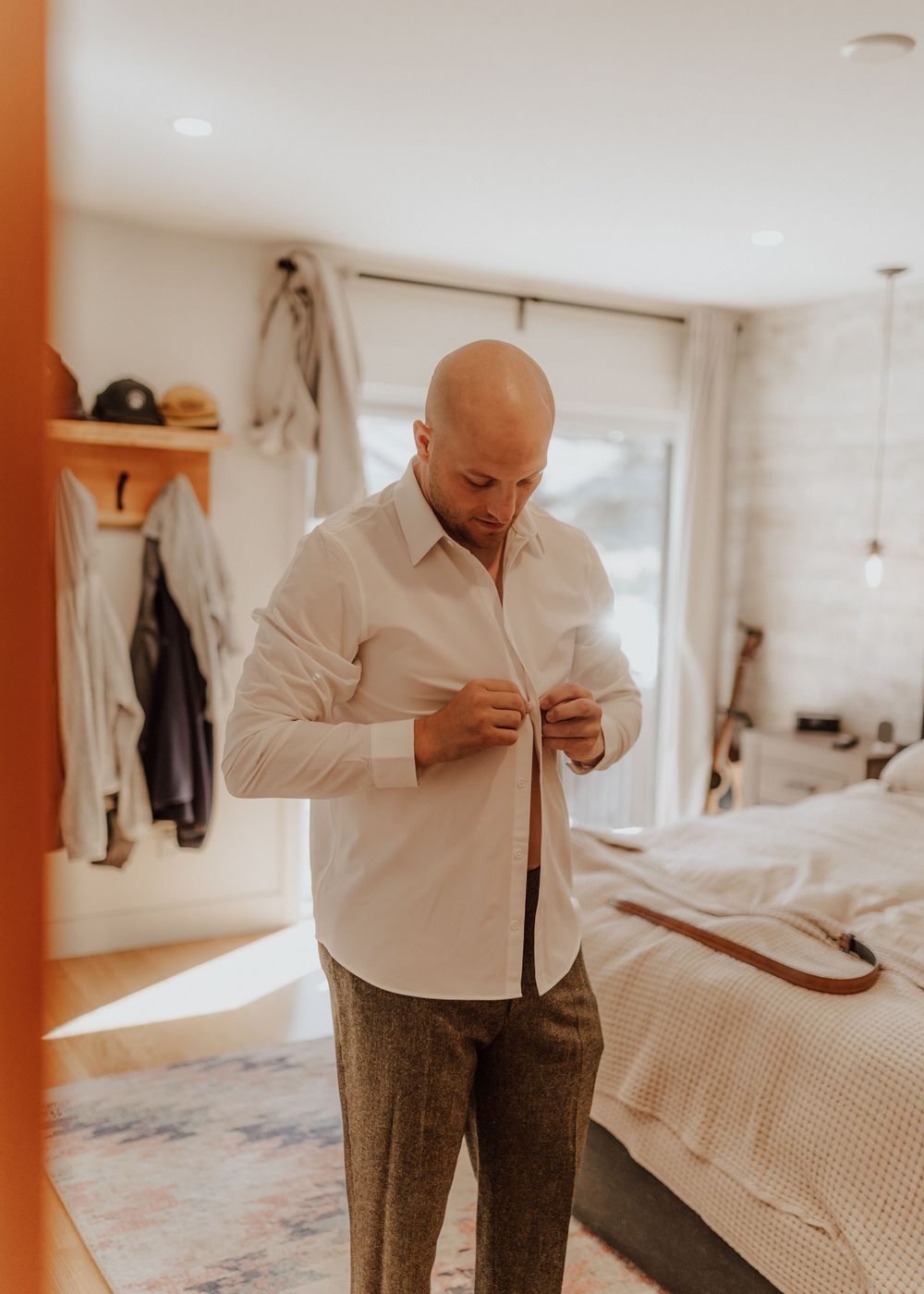 Canmore wedding photos with groom getting ready