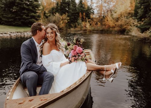 Alberta Wedding at Pine and Pond Wedding Venue bride and groom in pond