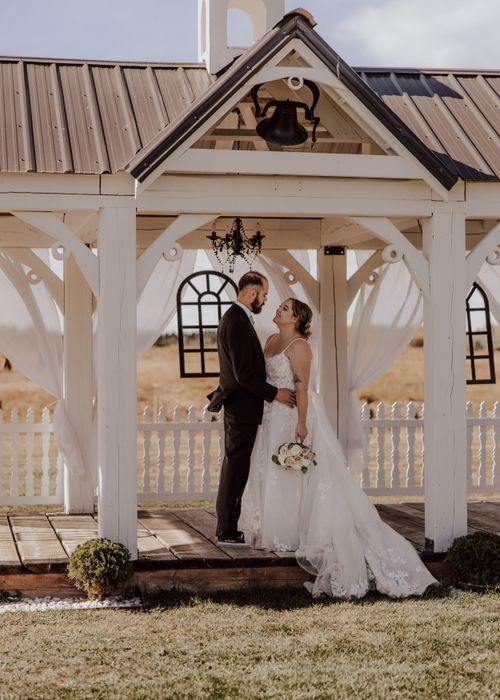 Calgary, Alberta wedding bride and groom in cabana at Diamond in the Rough Wedding venue