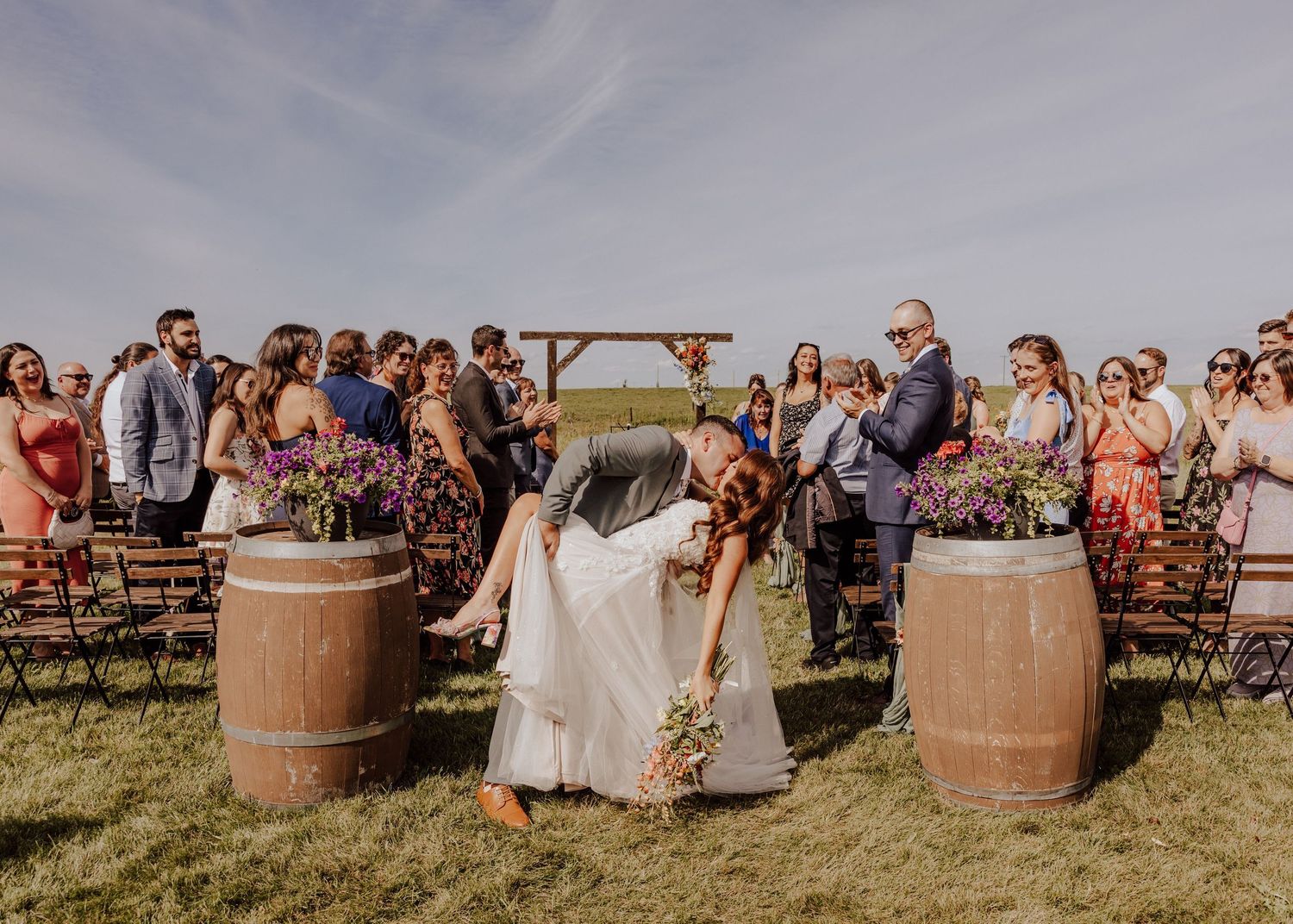 Calgary Alberta wedding ceremony with exit dip kiss