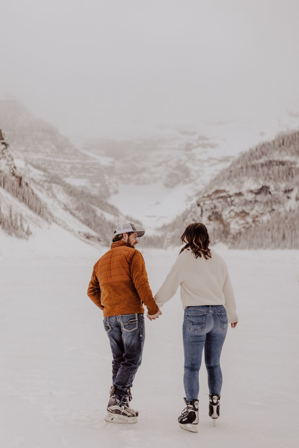 Lake Louise, Alberta engagement photos on skates