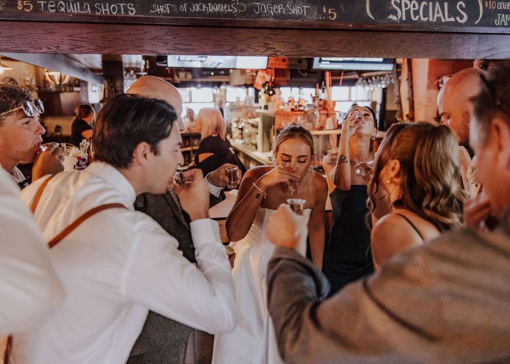 Canmore Wedding with wedding party doing a celebratory shot