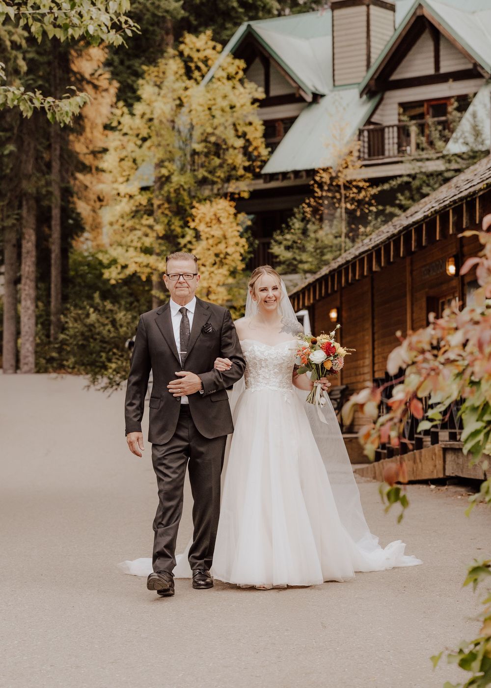 Wedding ceremony at Emerald Lake Lodge in Fields British Columbia father daughter entrance