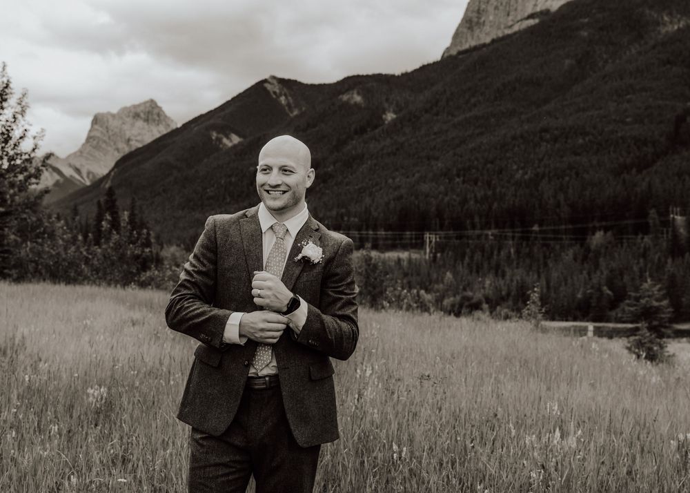Canmore wedding groom photos with mountain backdrop