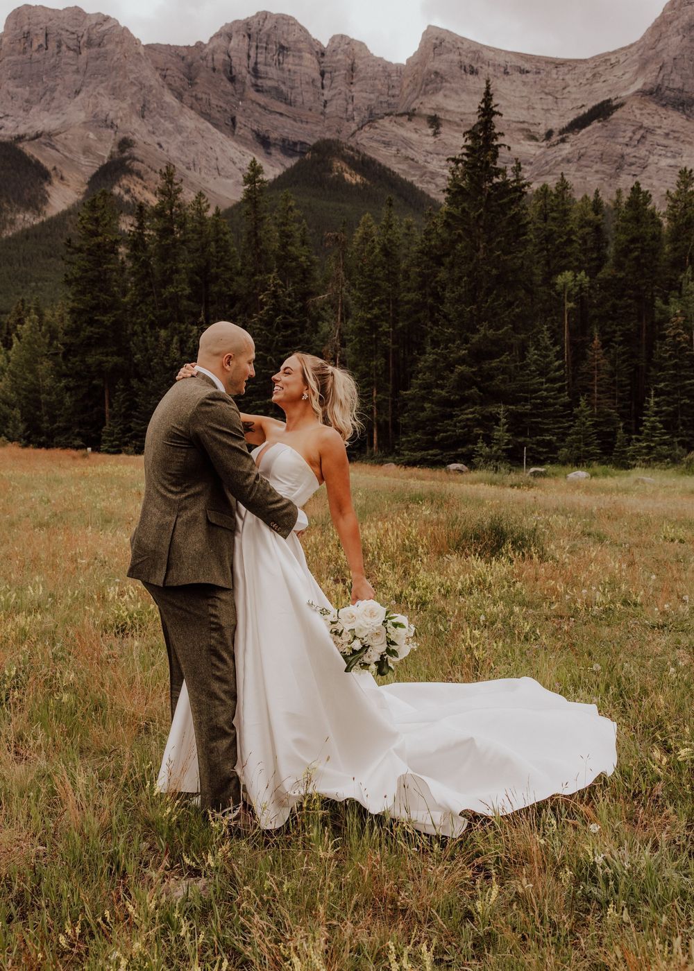 Canmore wedding photos with mountain backdrop