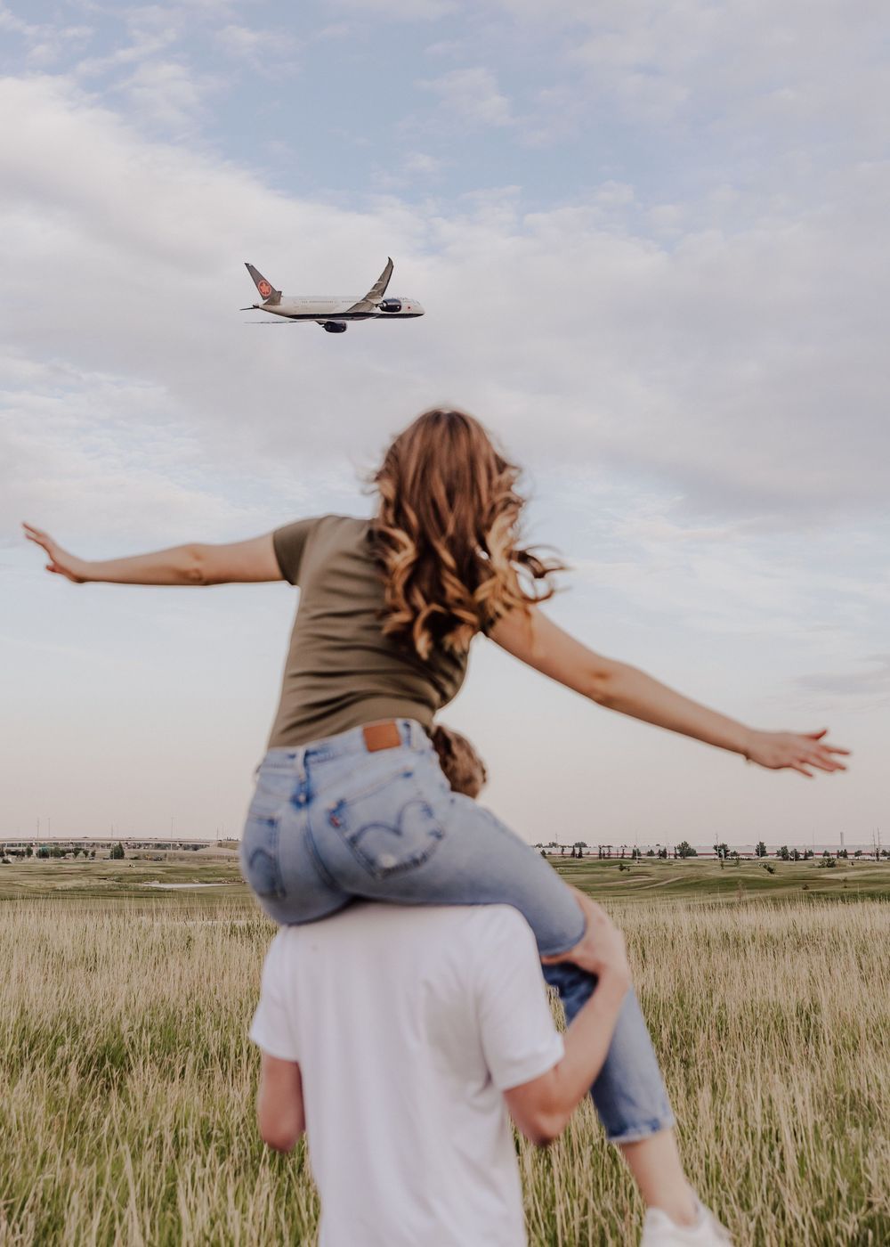 Calgary, Alberta couple session with airplane in background