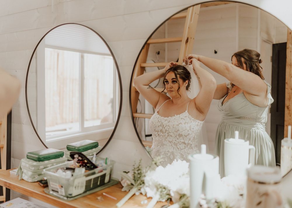 Calgary, Alberta Wedding bride getting ready with maid of honor