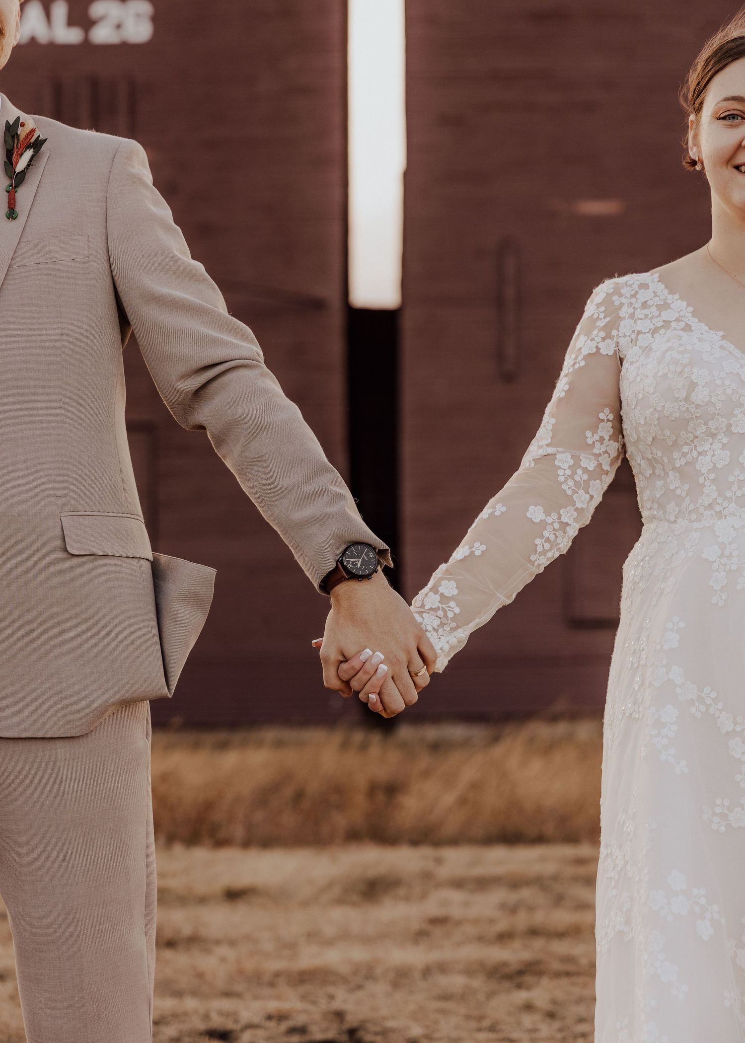 Alberta wedding bride and groom holding hands