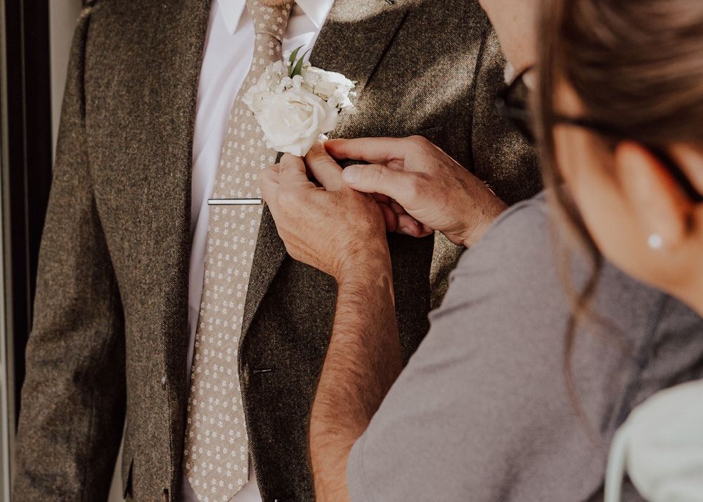 Canmore wedding photos with groom getting ready