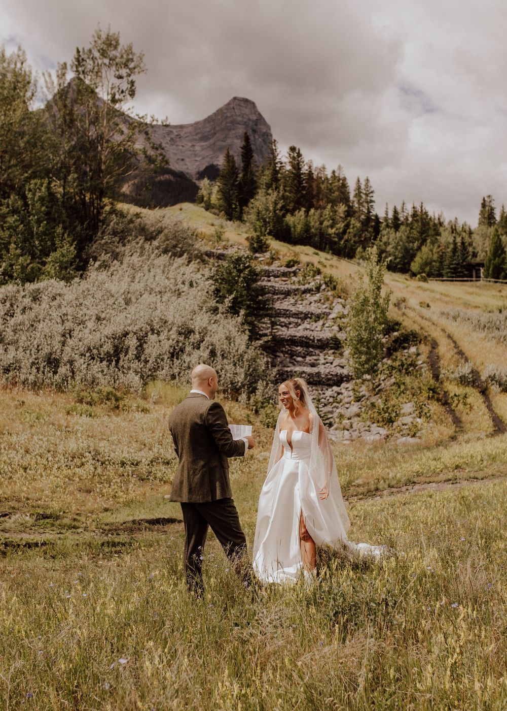 Canmore wedding first look with mountain backdrop