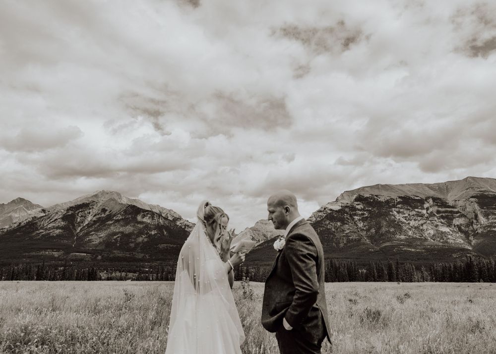 Canmore wedding first look with mountain backdrop
