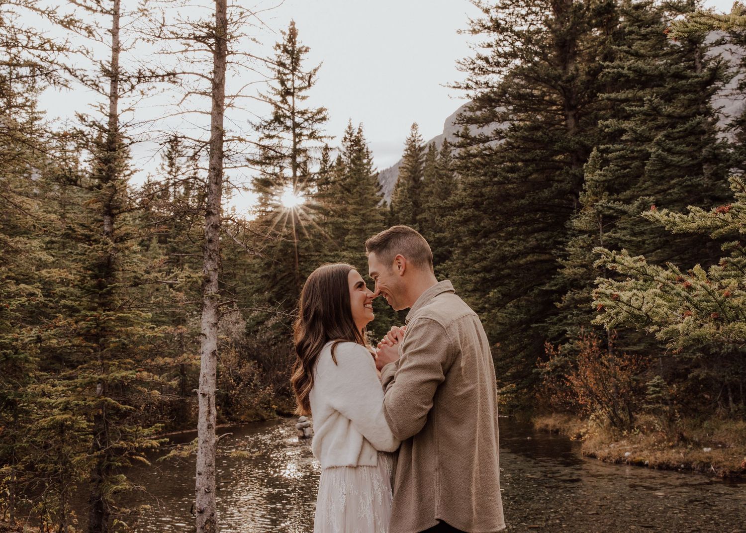 Canmore, Alberta engagement photos with trees and sunset
