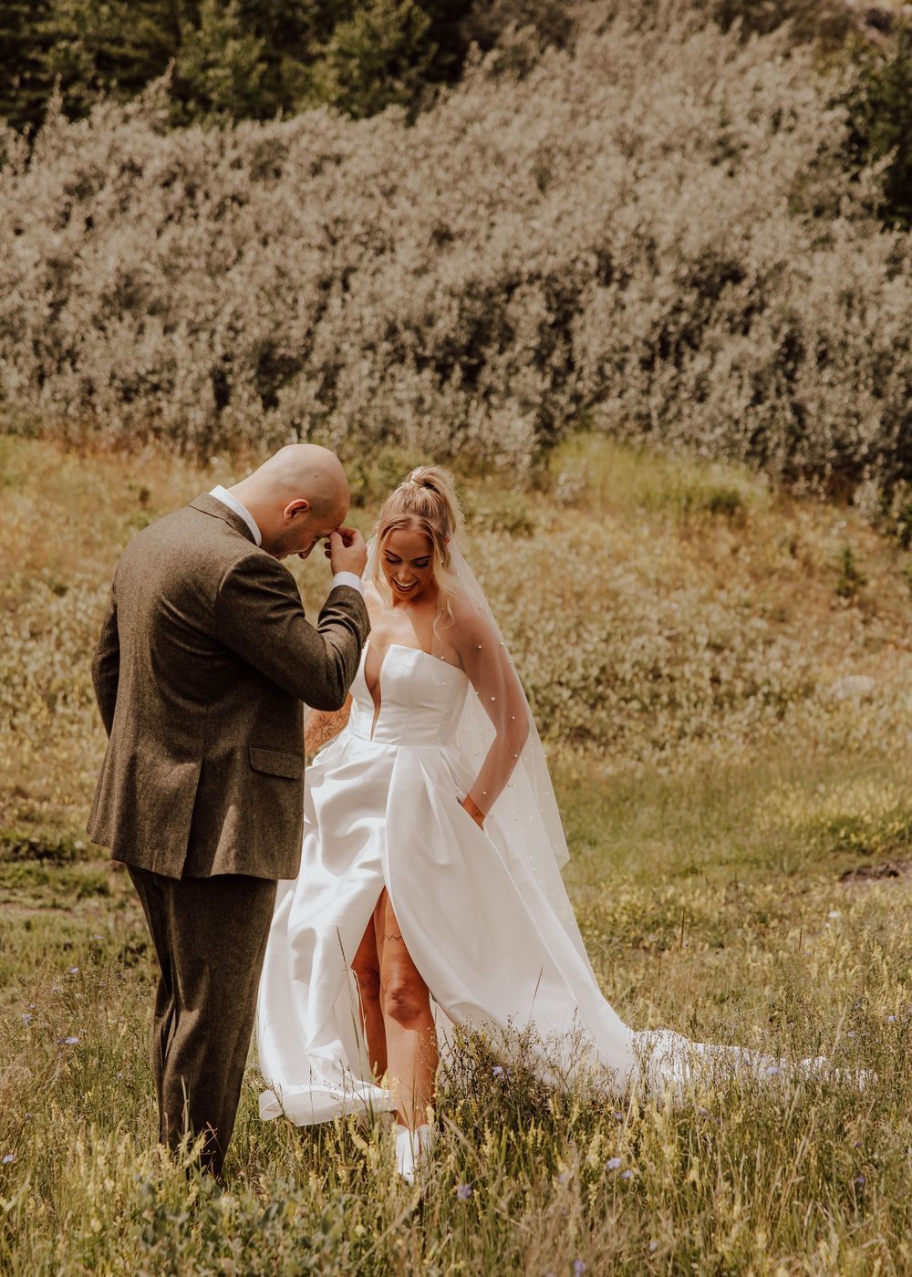 Canmore wedding first look with mountain backdrop