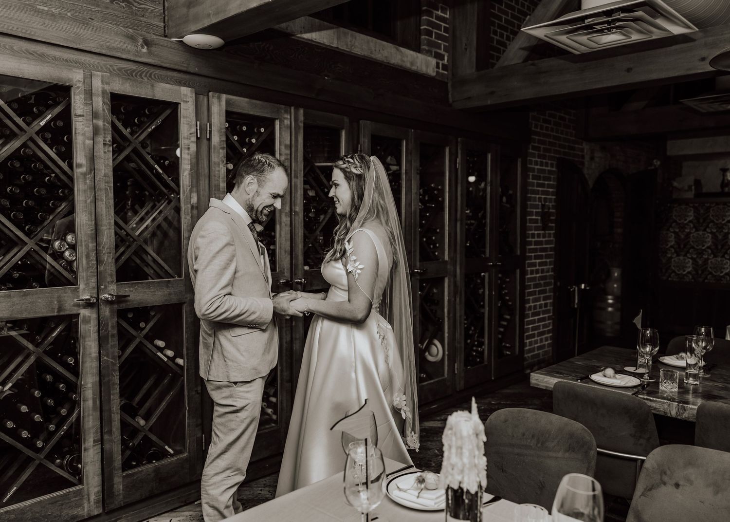 A series of black and white wedding photographs showing a couple in formal attire during their ceremony and reception.