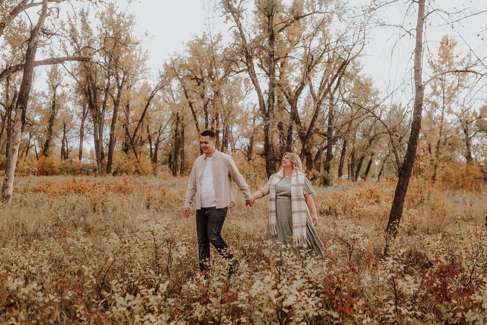 Calgary, Alberta engagement during fall with falling leaves
