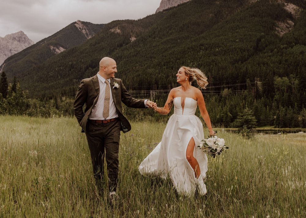 Canmore Wedding photos of bride and groom with a mountain background
