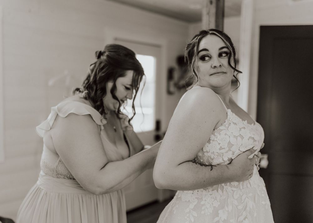 Calgary, Alberta Wedding bride getting ready with maid of honor