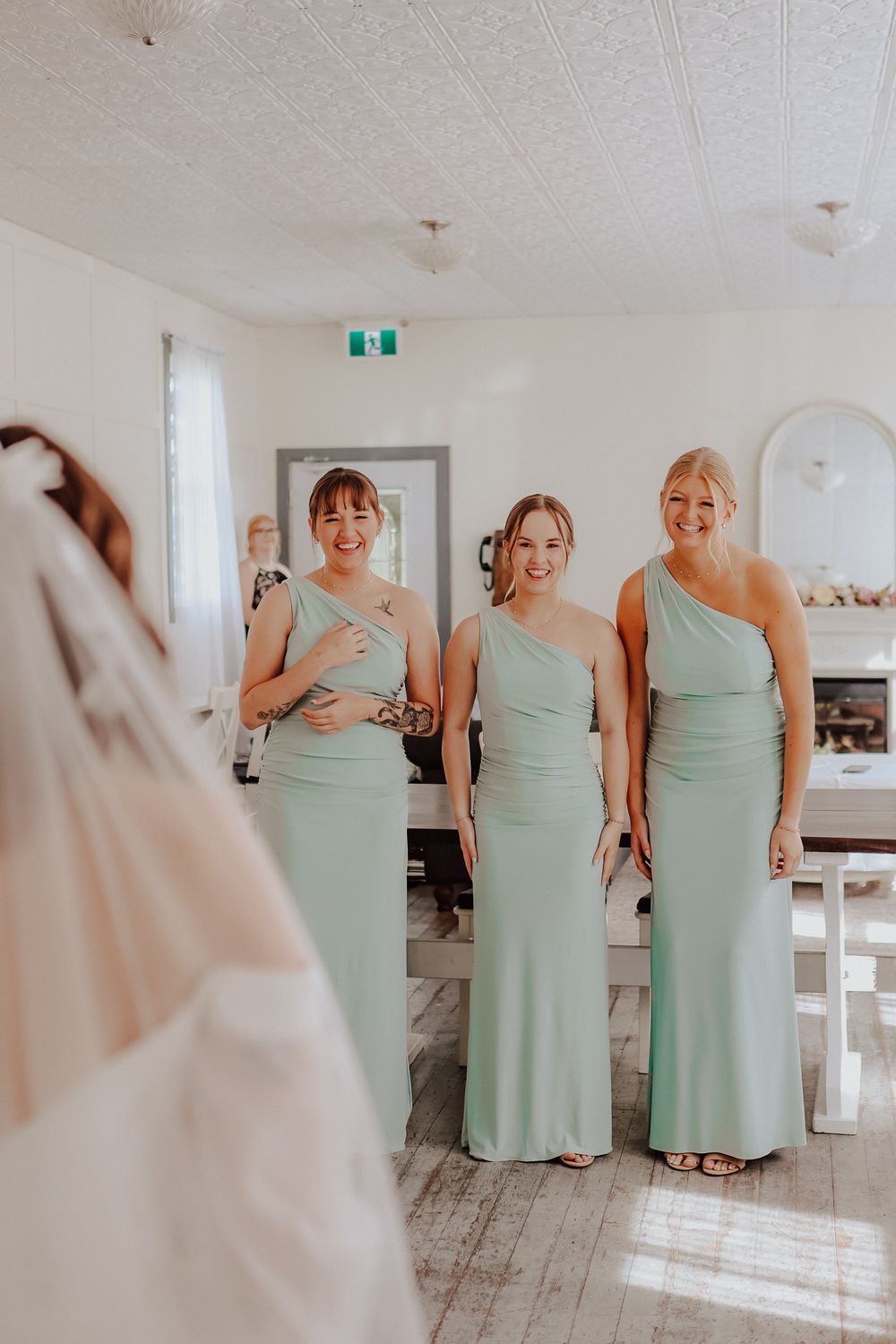 Alberta Pine and Pond Wedding Venue first look with bridesmaid
