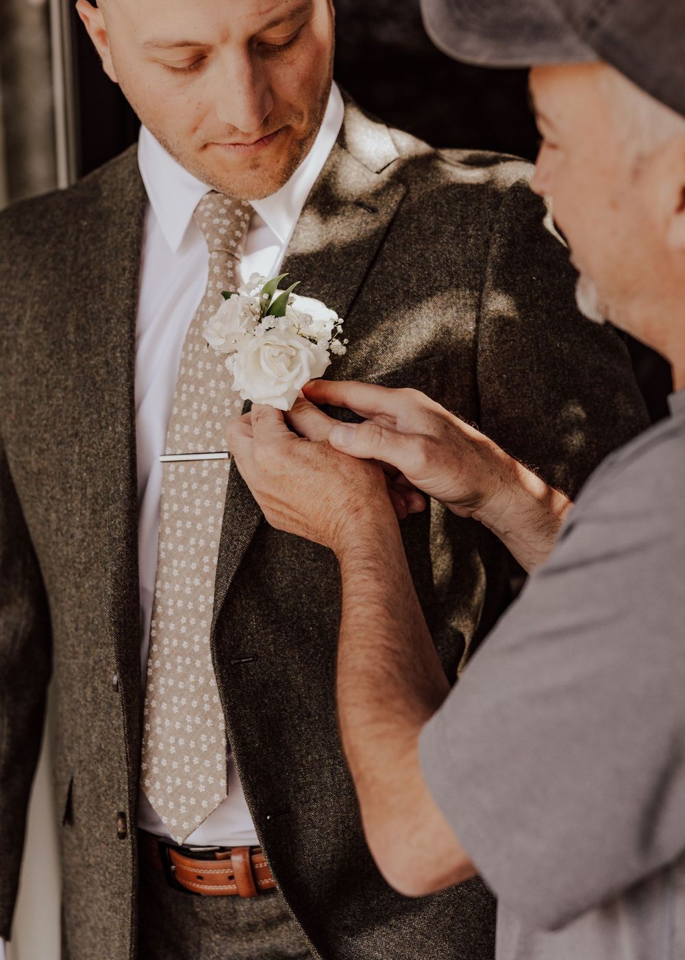 Canmore wedding photos with groom getting ready