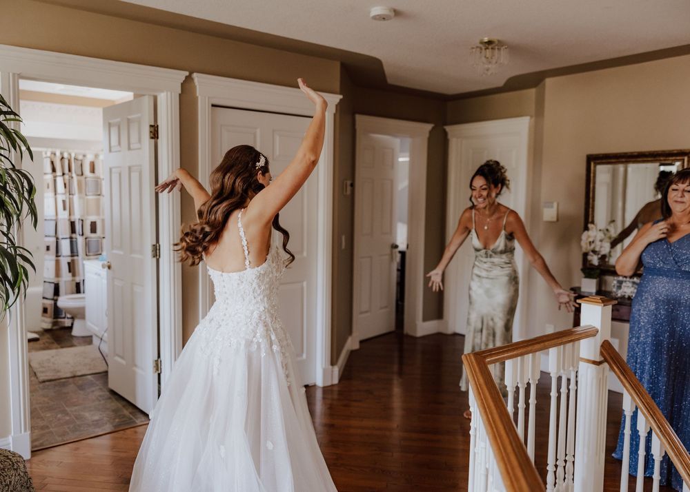 Calgary, Alberta Wedding bride and bridesmaid celebrate