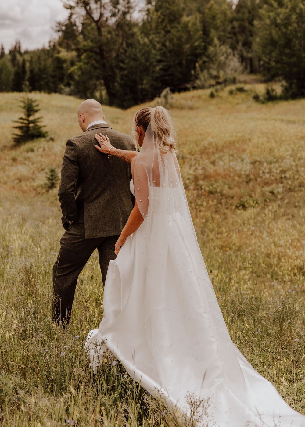Canmore wedding first look with mountain backdrop