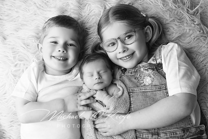 Black and white collage of intimate family moments showing closeness and affection on a cozy bed.