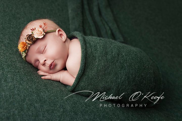 Professional newborn photography series on dark green textured backdrop showing peaceful sleeping baby poses.