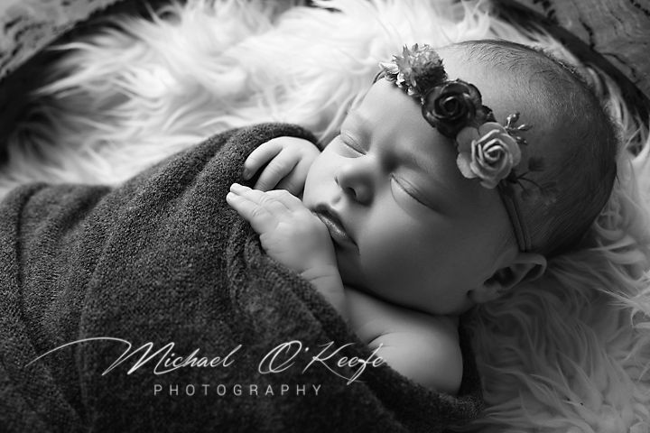 A black and white artistic portrait series showing dramatic lighting and ethereal poses against dark backgrounds.