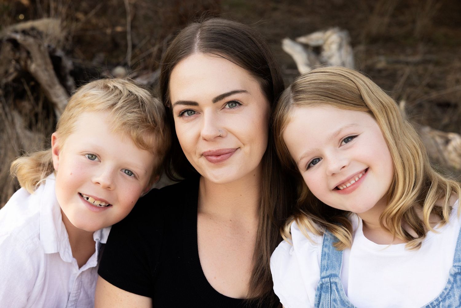 Family group photos taken outdoors against a dark rocky background.