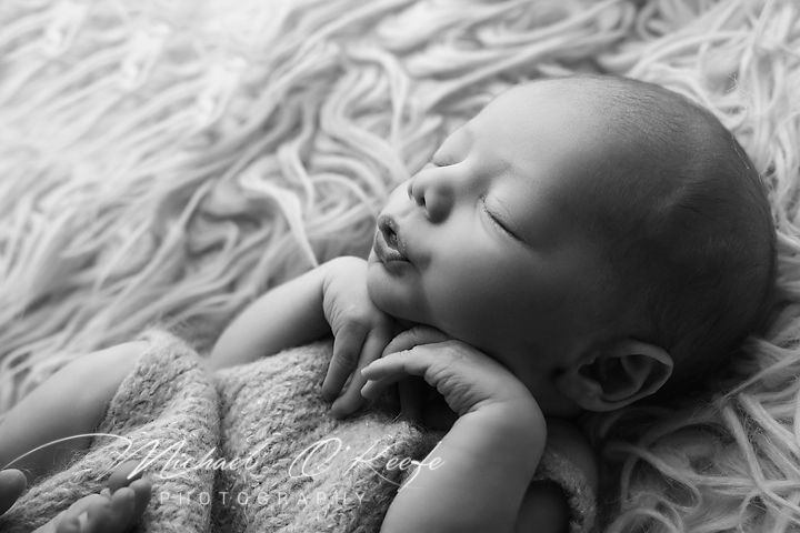 Black and white photo series showing a sleeping baby on soft textured blankets.